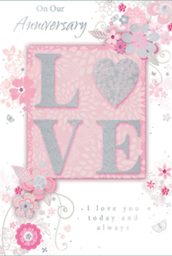 This anniversary card is pictured in soft, even light, its design evoking the feeling of stepping into a sunlit room where love is part of the everyday. Dominating the centre is the word LOVE, rendered in tall, delicate capitals raised from the surface of the card, each letter traced with frosted glitter that scatters light in icy silver and soft blush hues. The shimmer suggests the same subtle sparkle you'd see on fresh petals arranged in a vase on a windowsill in Pentonville, catching the afternoon sun drifting in from nearby streets. Around this central word, a border of wispy, hand-drawn blooms and tiny leaf sprays appears to drift inward from the edges of the card. Petals in blush pink, pale lilac and creamy white blend into one another with gentle shading, giving a sense of airiness, like flowers lightly placed rather than rigidly arranged. Slender tendrils curl and loop among the blossoms, resembling the natural movement of foliage in a hand-tied anniversary bouquet. Hidden among the floral tracery are subtle butterflies and filigree lines, small discoveries that invite the eye to linger, much as you would with a thoughtfully crafted arrangement. The background sits in a soft, warm pink, neither too bright nor too pale, creating a calming canvas that allows the raised letters and fine illustrations to stand out. Towards the lower portion, a simple yet heartfelt message-I love you today and always or similar tender wording-is printed in an understated script, echoing the quiet gratitude of a couple celebrating their years together in Pentonville, perhaps after a stroll by the Regent's Canal with a fresh bouquet waiting at home.